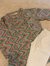 Load image into Gallery viewer, Patterned fabric with zigzag design on a beige surface