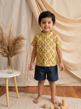 Load image into Gallery viewer, 
Child wearing Klingaru Shirt which is pure cotton in quirky print, breathable fabric 

