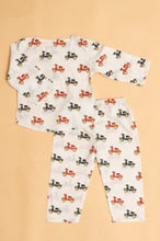 Load image into Gallery viewer, Children's pajama set with scooter pattern on a beige background
