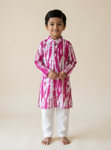 Load image into Gallery viewer, Child wearing a pink and white tie-dye kurta with white pants on a beige background
