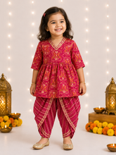 Charger l'image dans la galerie, Girl wearing pink printed frock style kurta with matching dhoti pants and gold detailing
