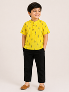 Boy wearing yellow Ikat print short kurta with black pants kids ethnic wear set